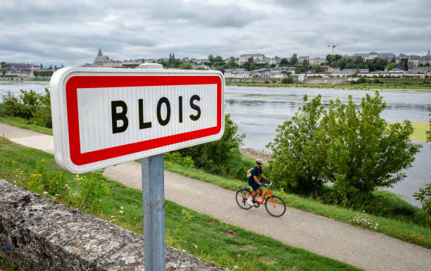 The town of Blois - Loire river Blois, France - August 11, 2023: Blois is a French city on the Loire River between Orleans and Tours. Cycle path along the Loire River. blois stock pictures, royalty-free photos & images