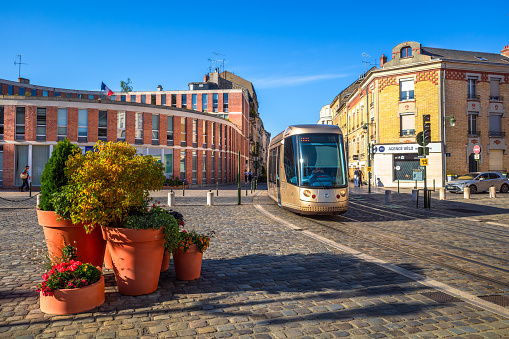 Orleans, France - August 10, 2023: Urban scene from the street of Orleans. Buildings, tram, street floral decoration
