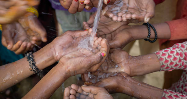 istock Poor Indian children asking for fresh water, India 1702993941