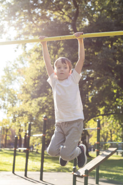 istock 6 year old boy doing sports training on the playground 1703007163
