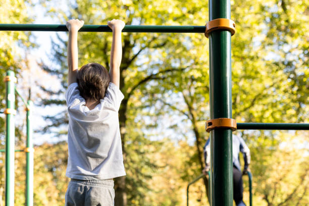 istock 6 year old boy doing sports training on the playground 1703007720
