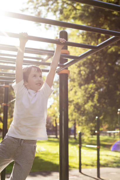 istock 6 year old boy doing sports training on the playground 1703007723
