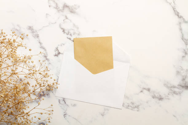 istock A white envelope with a brown paper inside on a marble kitchen counter in a top view 1703008267