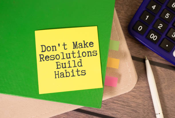 istock Wooden blocks with words 'Don't Make Resolutions Build Habits'. 1703066280