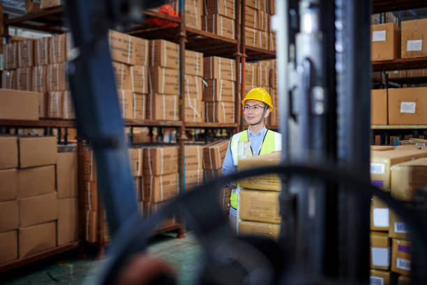 istock One Asian Warehouse Inspector Examining in Distribution Warehouse 1703084651