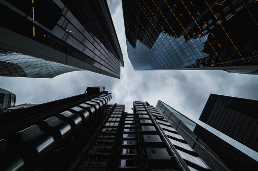 Looking directly up at the skyline of the financial district in central London