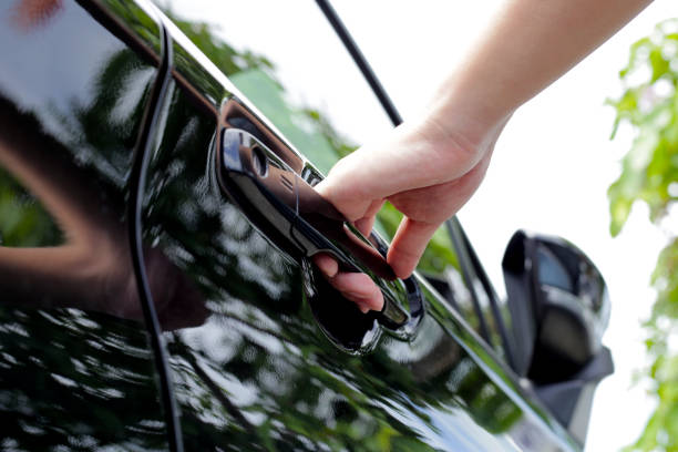 istock Male hand opening car door 1703114451