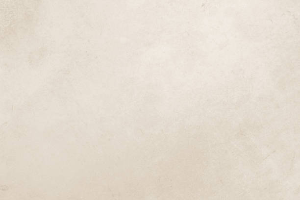 istock Colour old concrete wall texture background. Close Up retro plain cream color cement wall background texture. Design paper vintage parchment element show or advertise or promote product on display. 1703119801