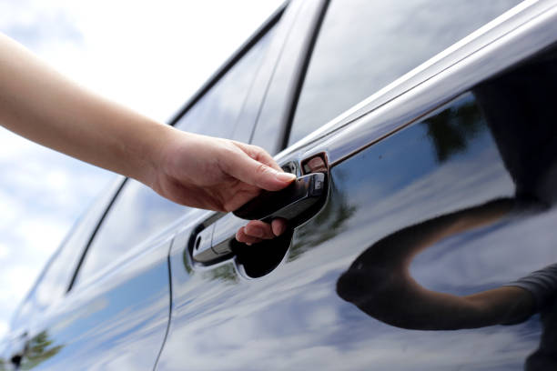 istock Male hand opening car door 1703137708