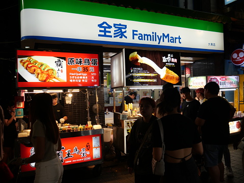 Taipei, Republic of China (Taiwan)-May 28, 2023: Street food at Shilin Night Market. It is the biggest night market in Taipei, Taiwan. It attracts lots of locals and tourists to visit this place. People walking around the area.