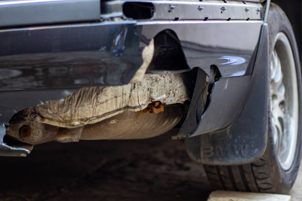 istock Broken bumper of a black European car 1703189246