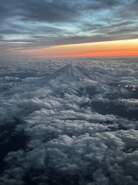 istock Mt. Rainier peeking out above the clouds in Washington state at sunset 1703209256