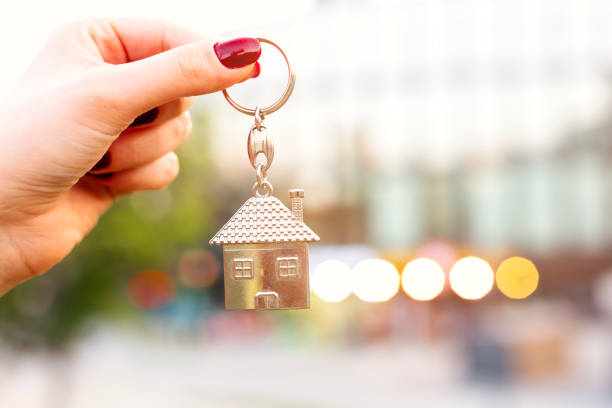 istock Real estate concept with home keys in hand 1703212047