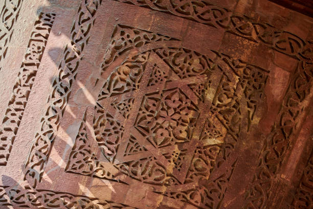 istock Wall decorative patterns of Qutb complex in South Delhi, India, close up ancient bas relief 1703216378