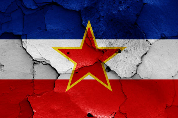 istock flag of Yugoslavia painted on cracked wall 1703222233