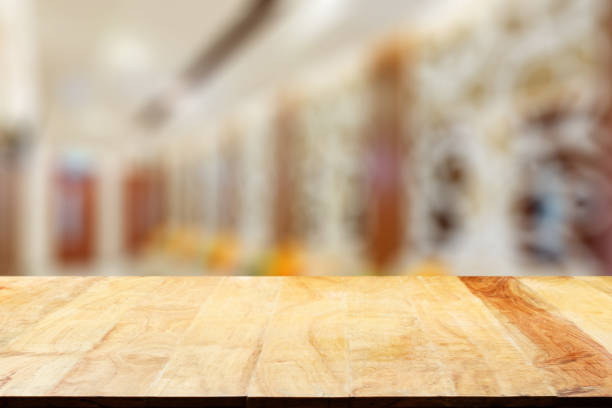 istock Empty wooden table and blurred cafe background, product display 1703237893