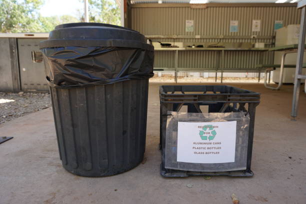 istock rubbish bin, garbage can and recycle bin for recycling aluminium cans, plastic bottles, glass bottles, in outdoor camp kitchen on campground in northern territory, australia 1703246164