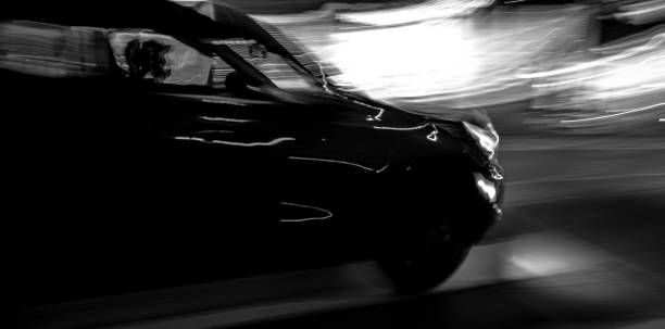 istock CAR AT NIGHT IN BLURRY MOTION 1703246381