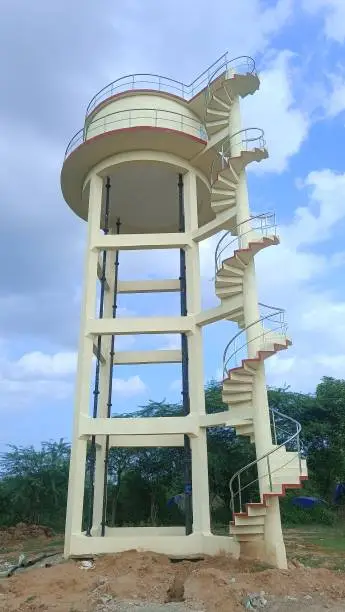 Photo of Indian water tank with a circular staircase attached to it