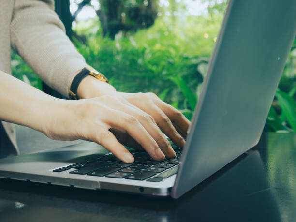 istock Young asian business woman using a notebook to work at the office, co-working space, cafe or work from home. 1703319956