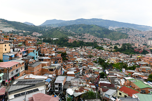 Medellin, Colombia - Apr 14, 2022: Colorful streets of Comuna 13 district in Medellin, Colombia, a former crime ridden neighborhood.