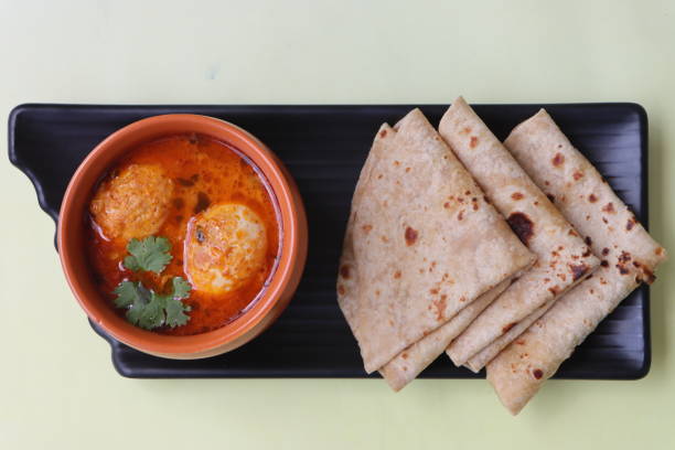 istock Egg curry or Anda curry or egg masala, popular spicy food, Indian non veg side dish for rice, roti, Appam, Chapati, Porotta, Parantha 1703405833