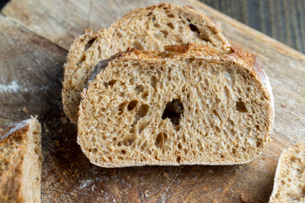 istock Dark wheat loaf of bread 1703410704