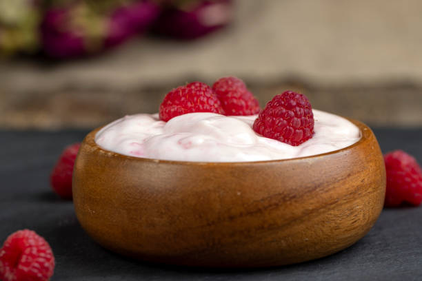 istock fresh yogurt with raspberry flavor, close up 1703411389
