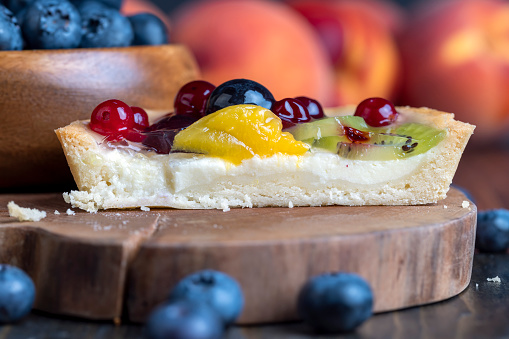 Shortbread fruit cake with cheese cream and berries, delicious cake with different berries