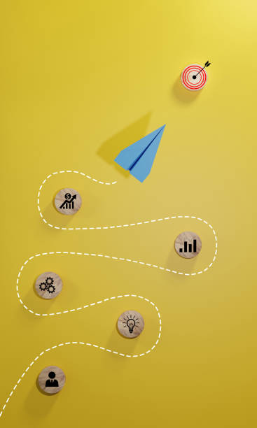 istock Leadership concept with blue paper plane leading among white on yellow background. 1703428221