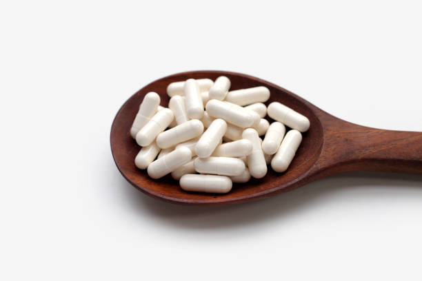 istock Medicine capsules on white background. 1703449774