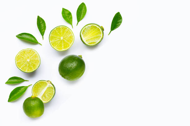 istock Limes with leaves isolated on white background. 1703451361