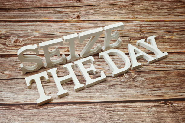 Seize The Day alphabet letters on wooden background