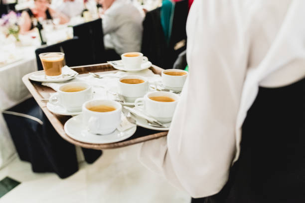 istock Waiter serving coffee during an event in cups. 1703471989
