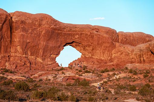 Dozens of tourists on trail to North Window Arch, Arches National Park, Utah, USA.
