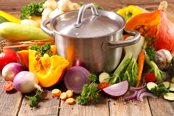 casserole with fresh vegetables for cooking soup stock photo