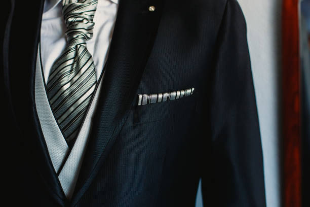 istock Groom dressing to go to his wedding 1703504271