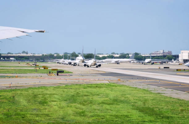 istock airport with jet airplanes and runway under a blue sky and copy space 1703518236