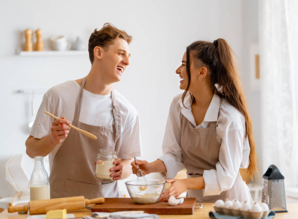 istock couple is preparing the pastry 1703519342