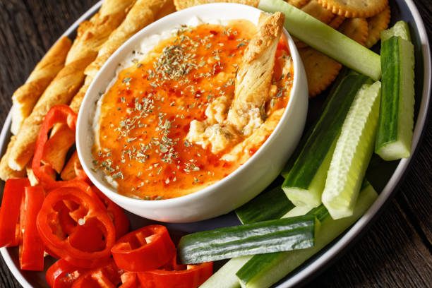 istock Hot Pepper Jelly Cheese Dip with crackers, veggies 1703521977