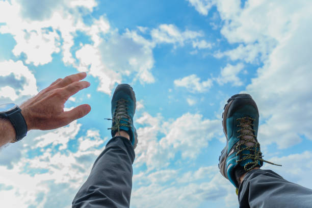 istock man falling from the sky seen in first person 1703523052
