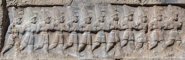 Istanbul, Turkey-June 9, 2013: Obelisk in Sultan Ahmet Square, Rowed human reliefs on the lower part of the obelisk.