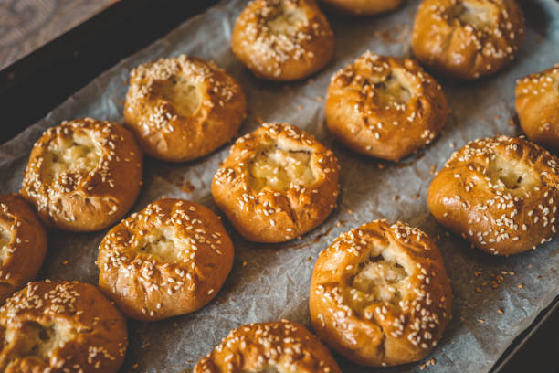 istock Homemade freshly baked buns background top view 1703547532