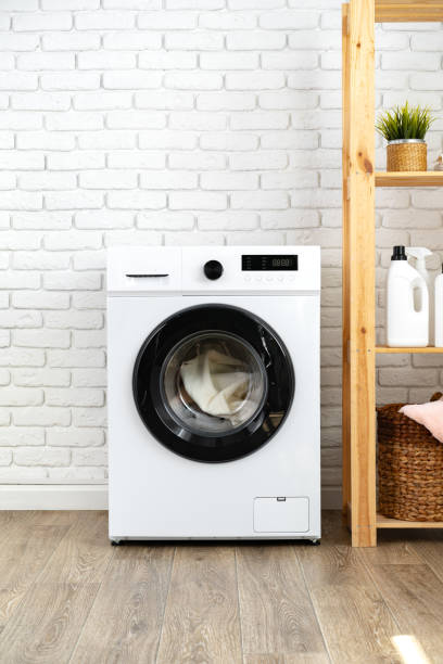 istock Modern white washing machine close up photo 1703552447