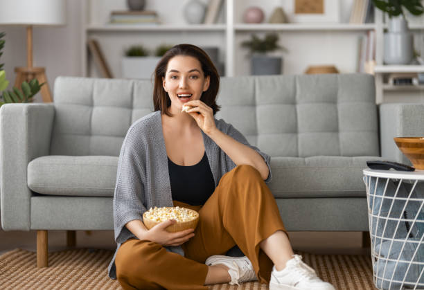 istock woman watching TV 1703555141