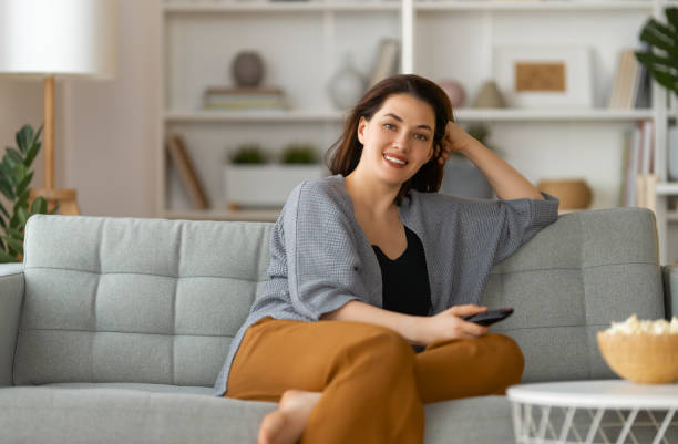 istock woman watching TV 1703556839