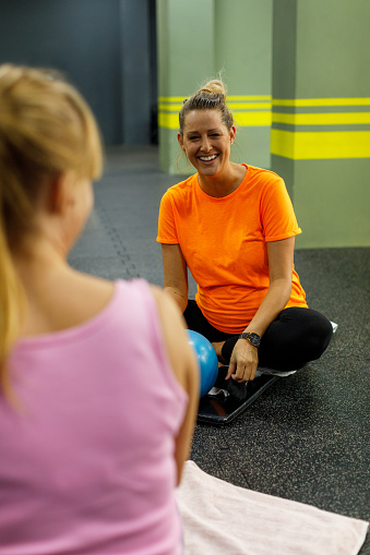 Portrait of beautiful smiling pregnant woman in the gym.