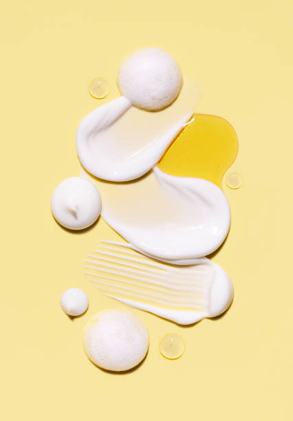 istock composition of cosmetic smears cream texture on pastel background 1703572829