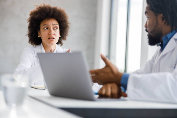 istock Black medical experts talking on a meeting at doctor's office. 1703580551