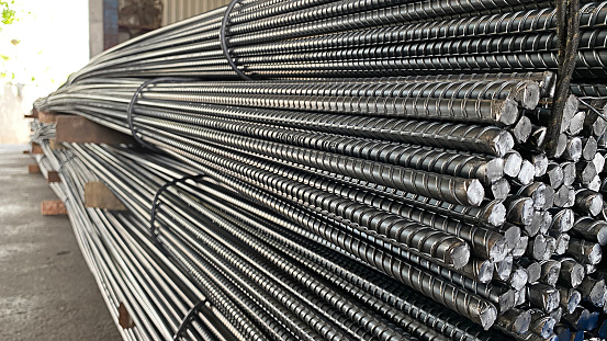 Reinforced steel bars and deformed steel bars along with steel bars at the construction site. reinforcing steel bars are reinforced in the continuous structure of a building.